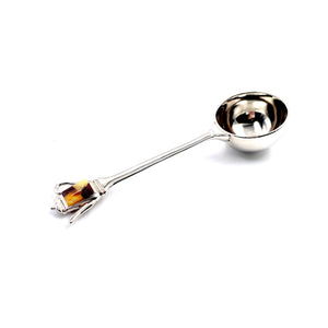 Coffee scoop decorated with amber mosaic