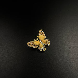 Butterfly brooch decorated pieces of amber