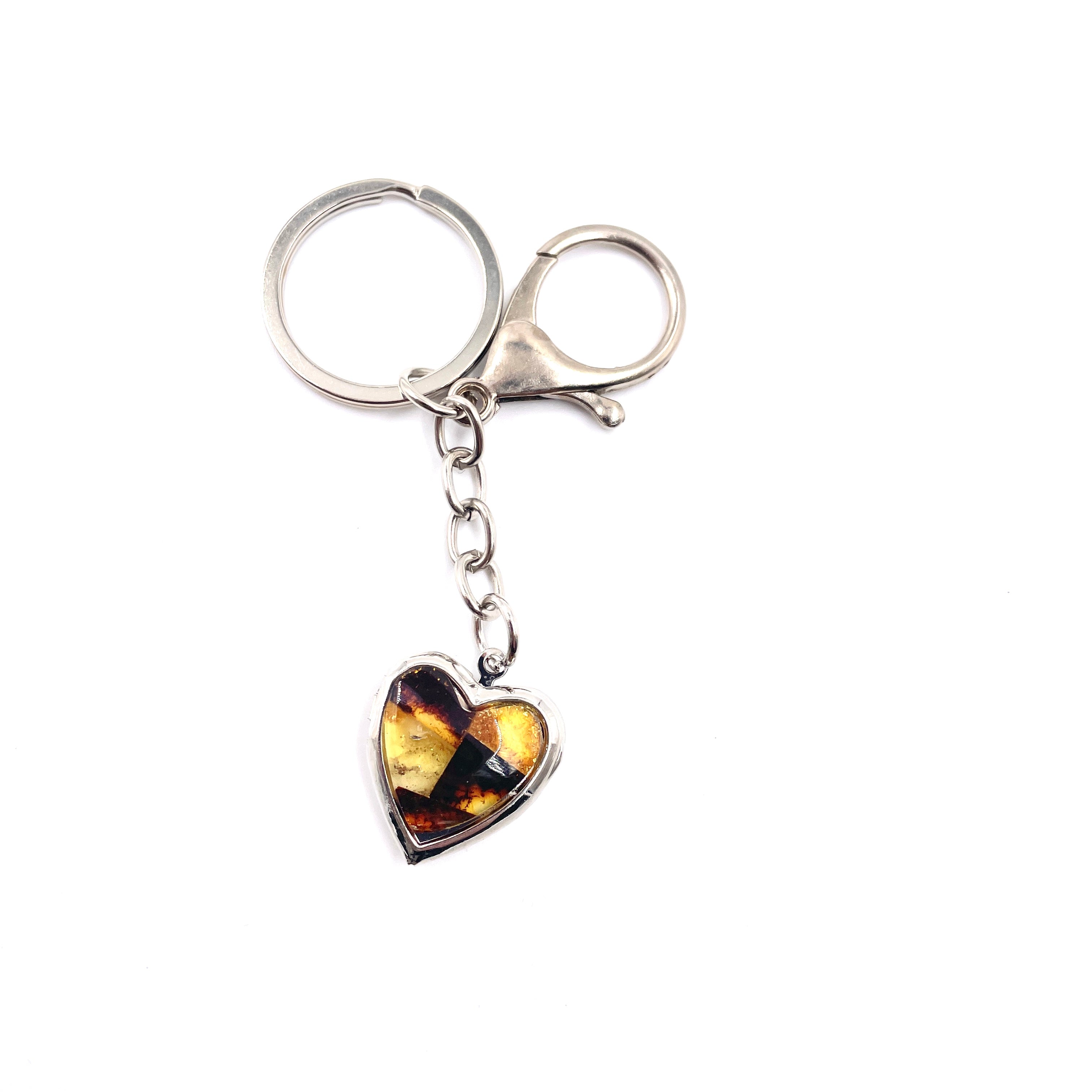 Heart-shaped keychain decorated with amber mosaic