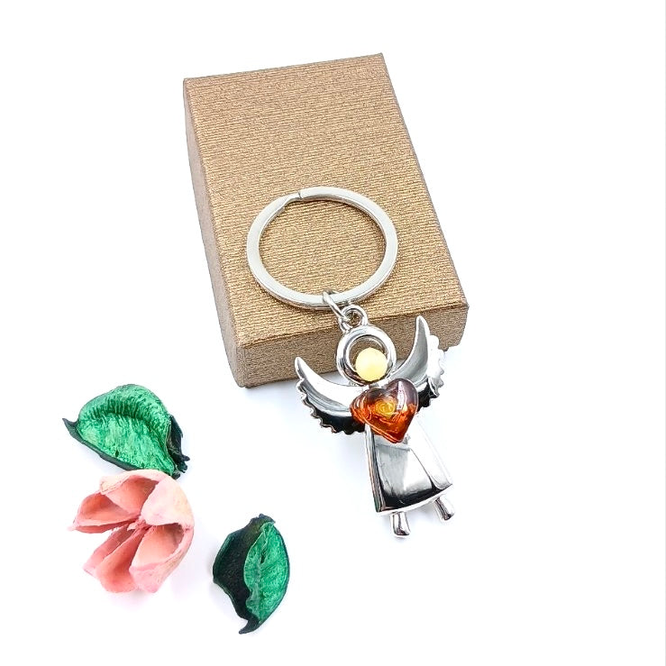 Angel keychain detail showing natural Baltic amber accents
