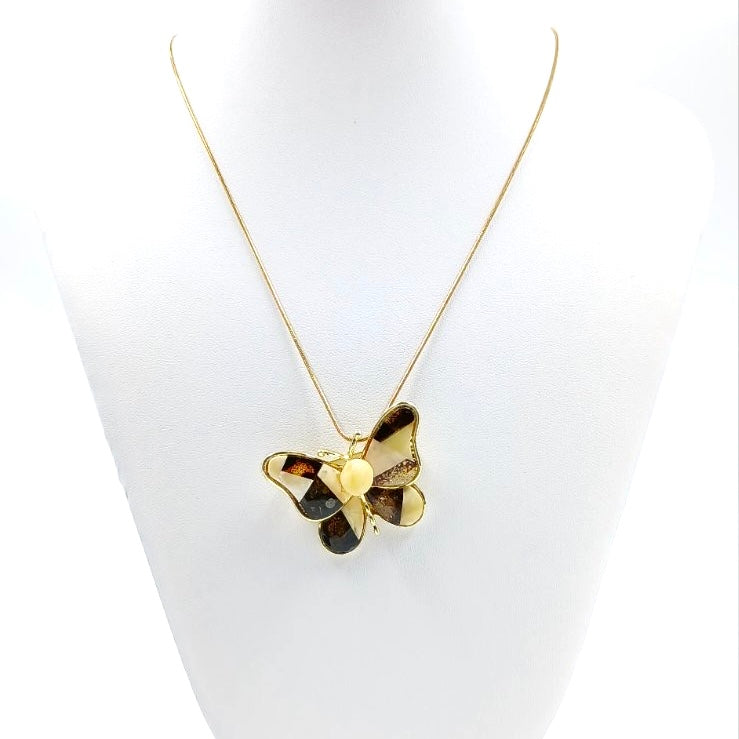 Butterfly brooch detail showing natural Baltic amber mosaic