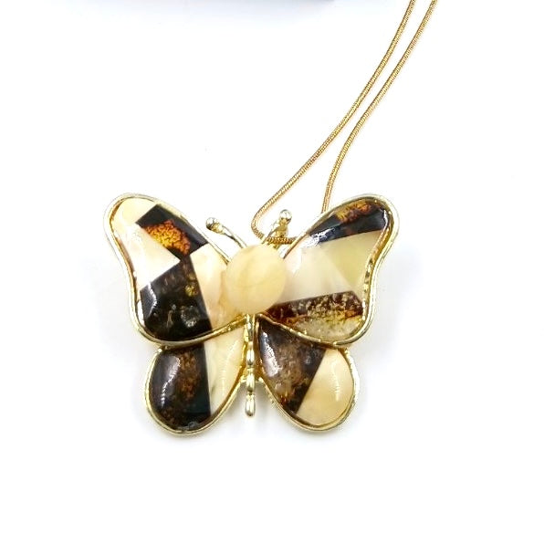 Butterfly brooch with amber worn as necklace