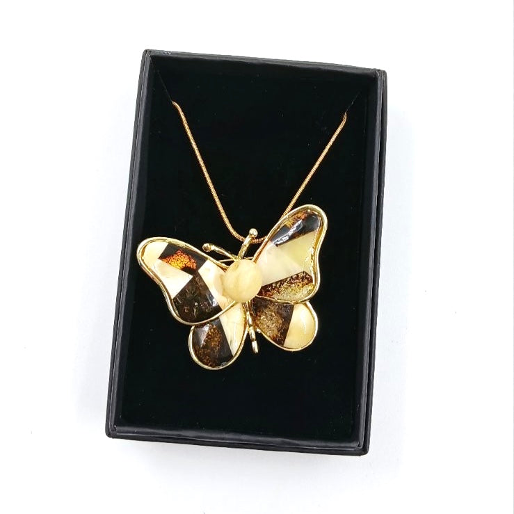 Close-up of butterfly brooch amber mosaic pattern