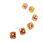 Game dice with natural amber embedded inside