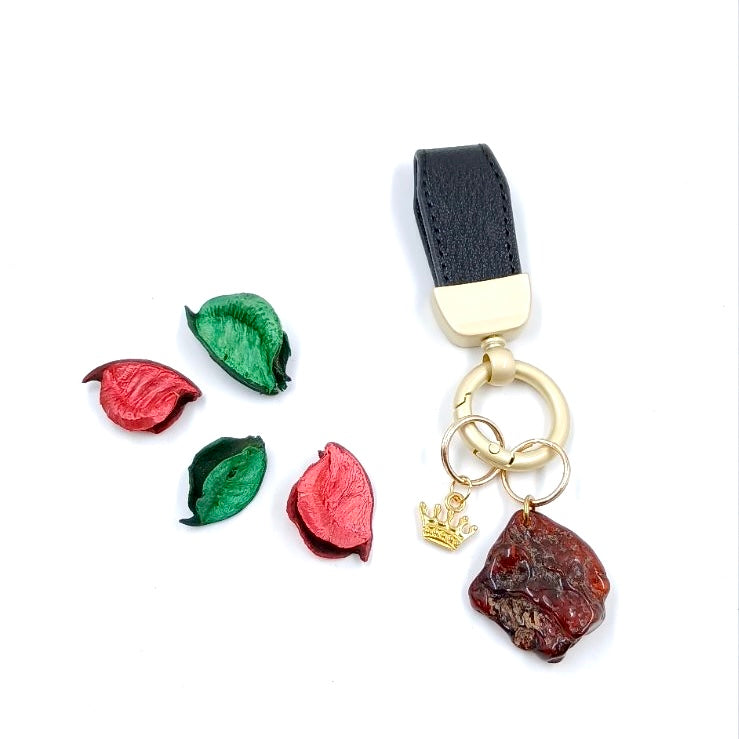 Handcrafted black-brown amber keychain on leather strap with metal keyring