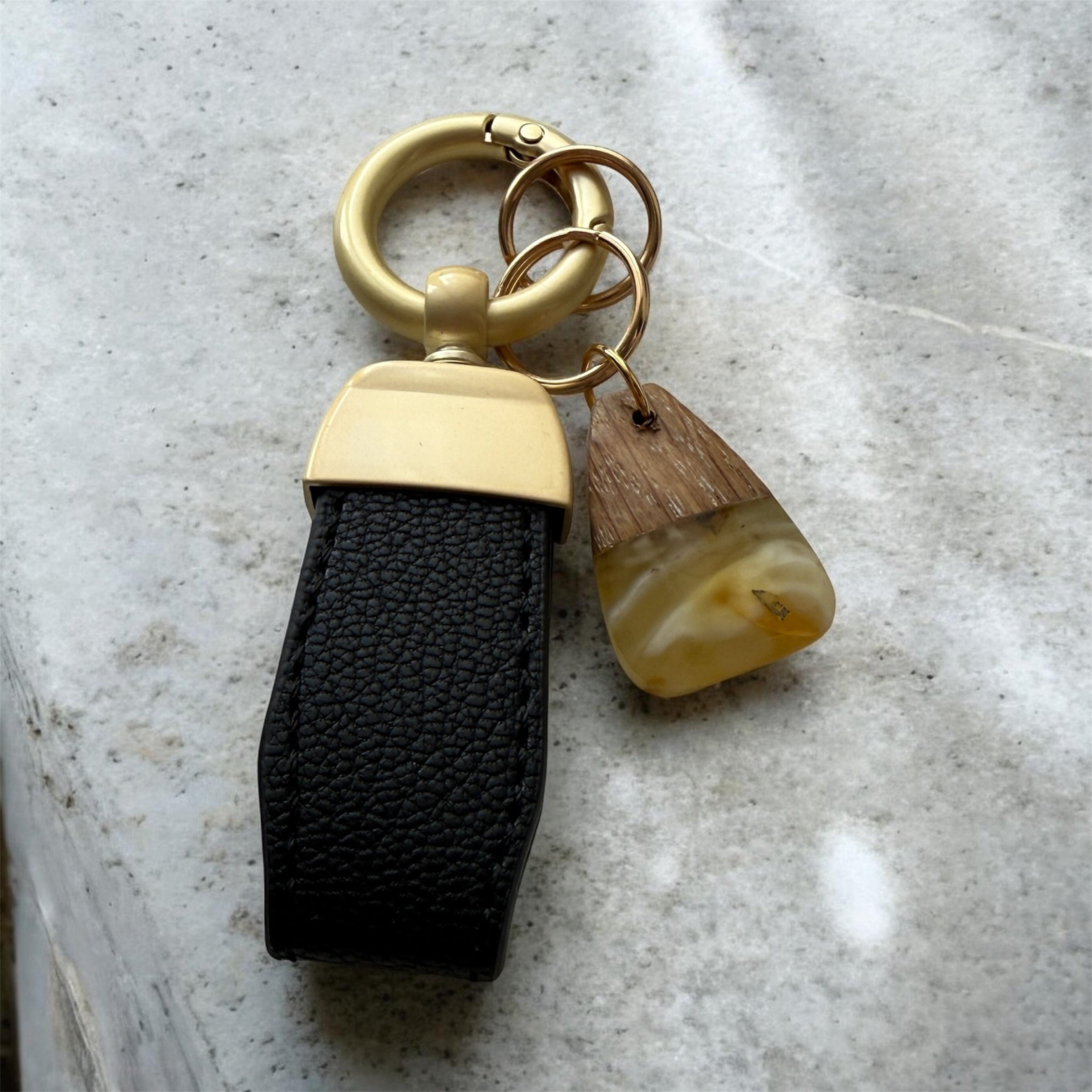 Handmade style keychain with natural amber stone and wood detail