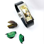 Natural honey amber stones set in genuine leather - close-up detail