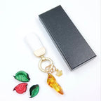 Natural white amber keychain accessory with leather cord - artisan crafted in Lithuania