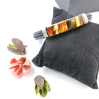 Silicone and leather bracelet detail showing unique texture combination