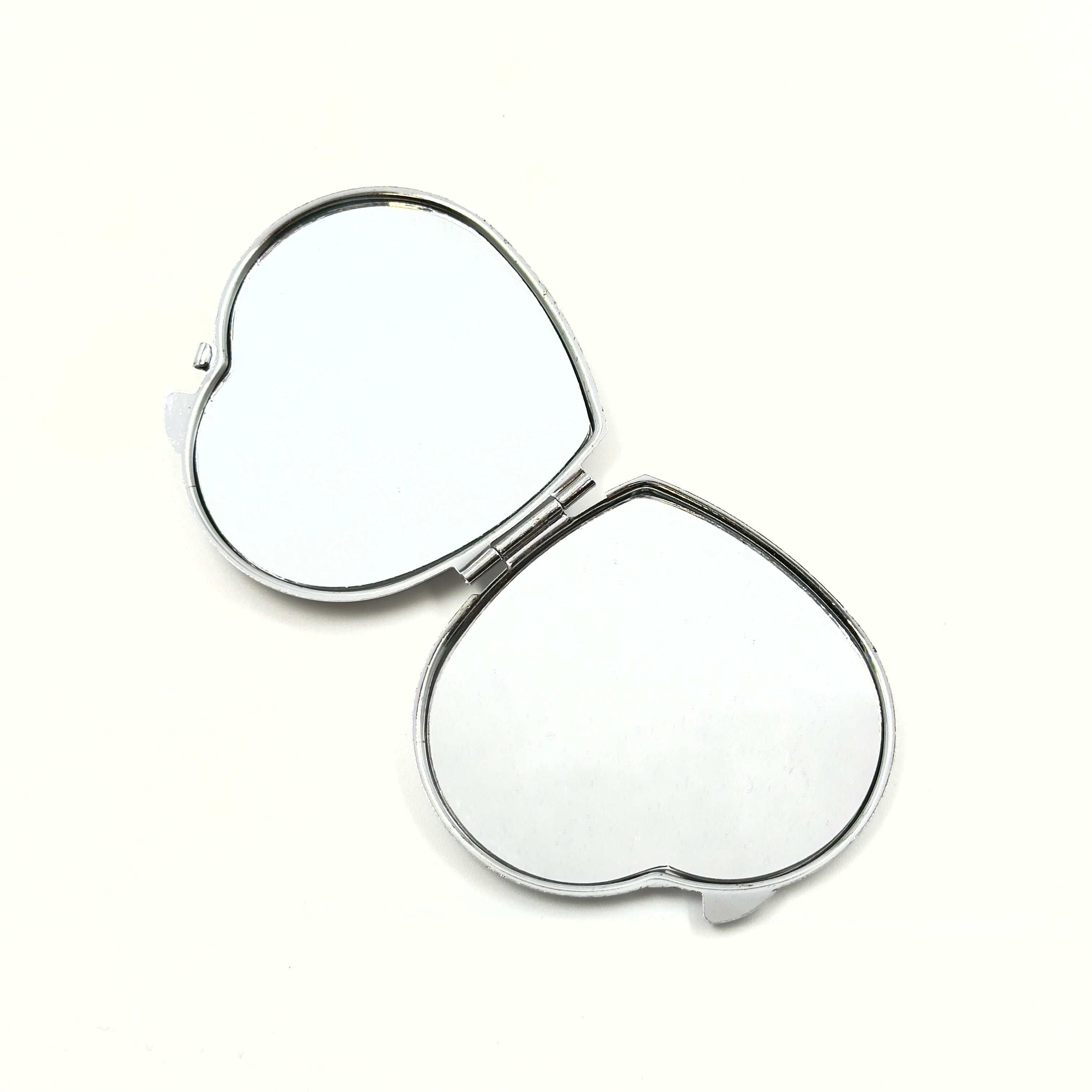 Heart-Shaped Compact Mirror With a Silver Frame