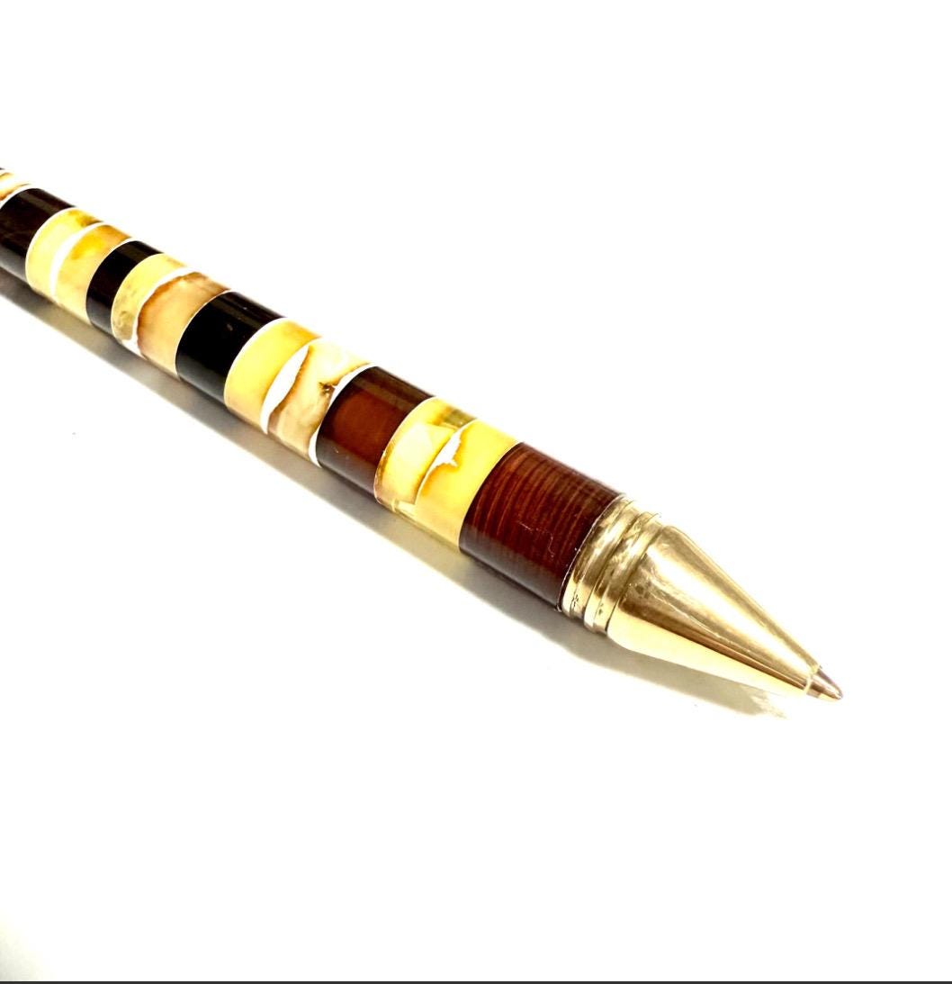 Handmade wooden ballpoint pen decorated with genuine Baltic amber inlay