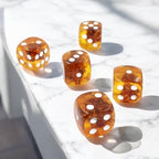 Natural Baltic amber dice close-up with organic texture