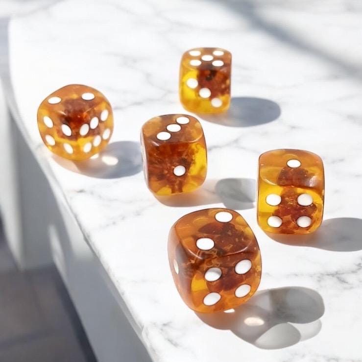 Natural Baltic amber dice close-up with organic texture