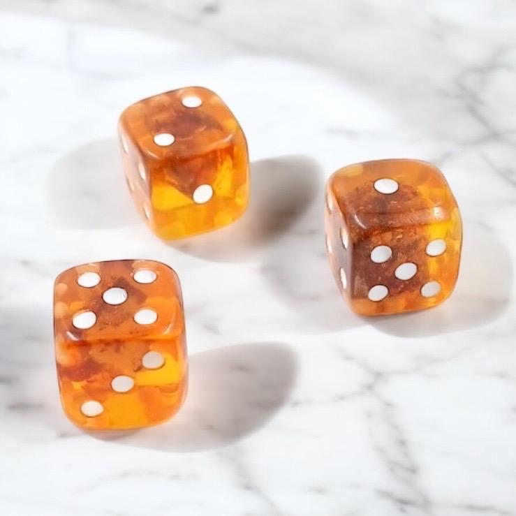 Natural Baltic amber dice with honey and cognac tones