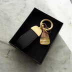 Handmade style keychain with natural amber stone and wood detail