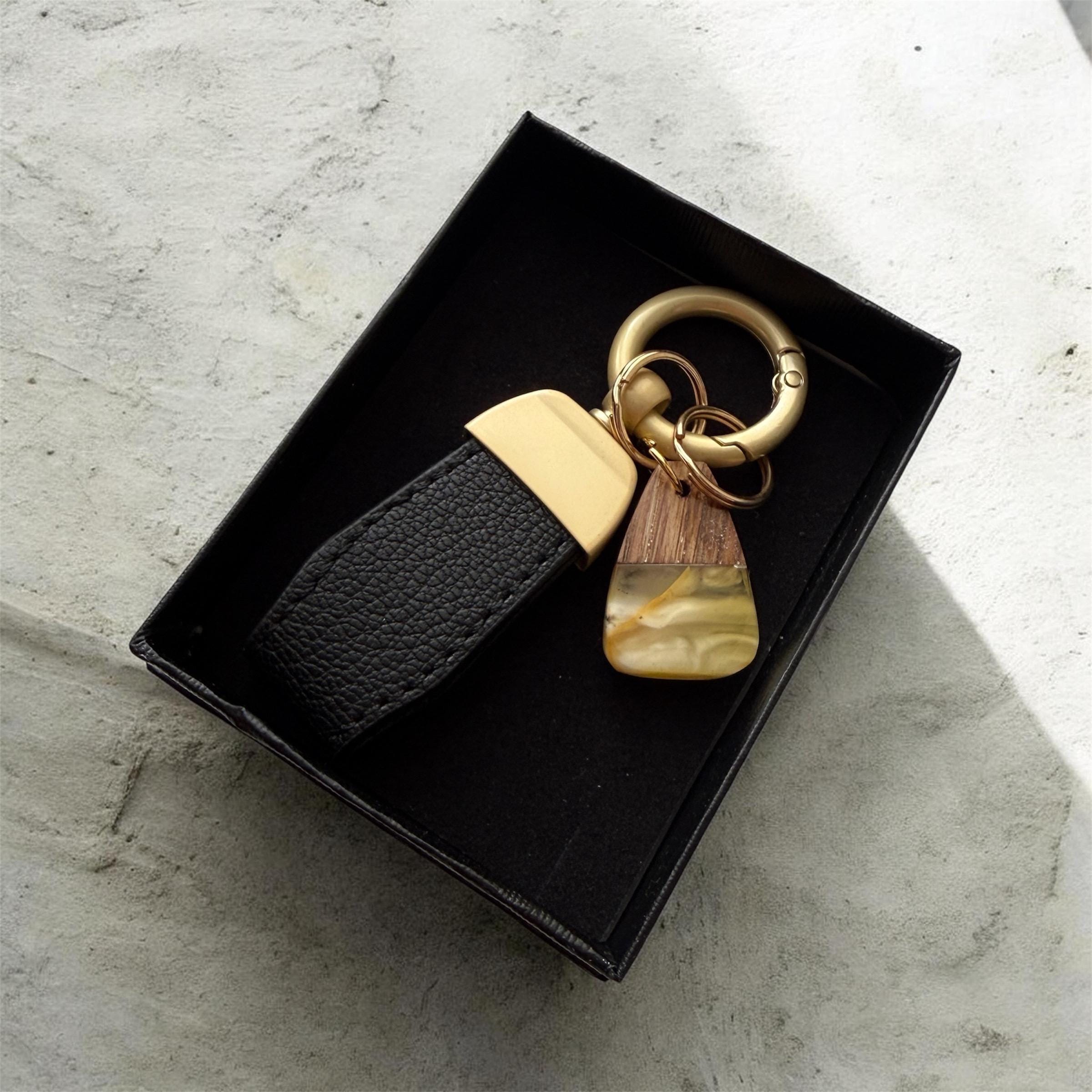 Handmade style keychain with natural amber stone and wood detail