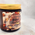 Handmade Baltic Amber scented soy wax candle in a 120 ml amber glass jar with natural Baltic amber pieces