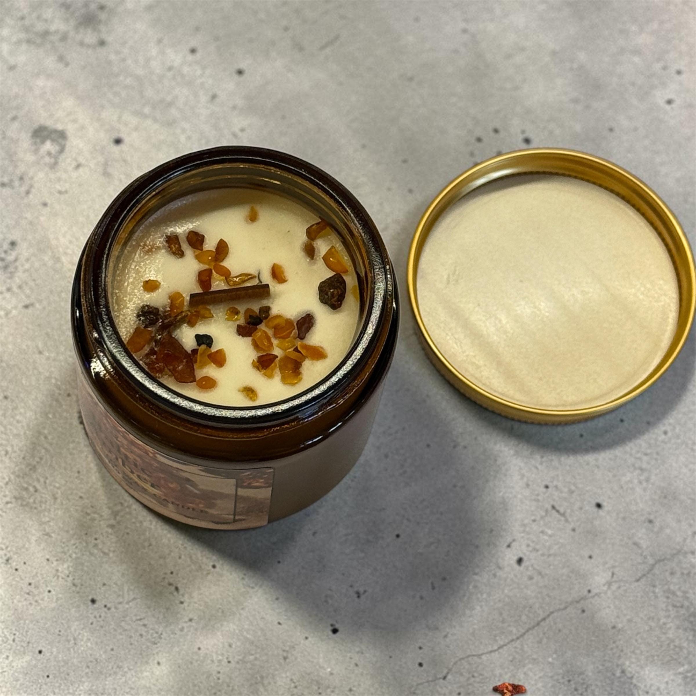 Luxury Baltic Amber soy candle in a brown glass jar, handcrafted with natural soy wax and real Baltic amber chips for home décor and gifting.