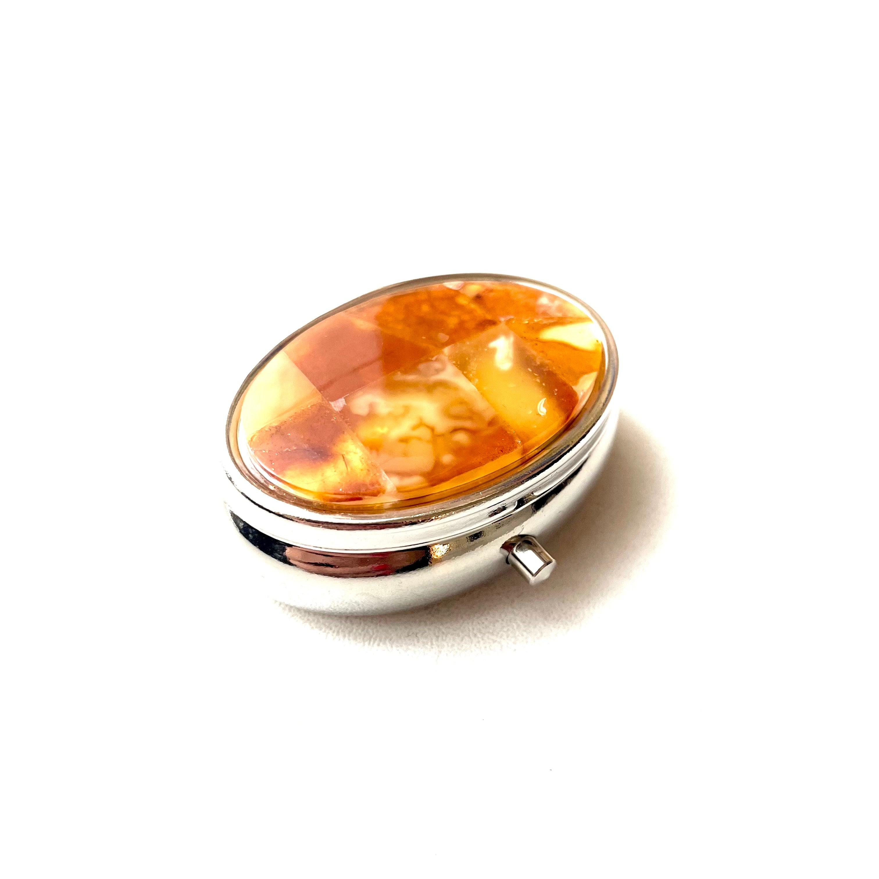 Oval travel pill box with natural Baltic amber mosaic, handmade in Lithuania